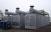 drei Aggregatecontainer mit Abgasschalldämpfer und Kühler auf dem Dach